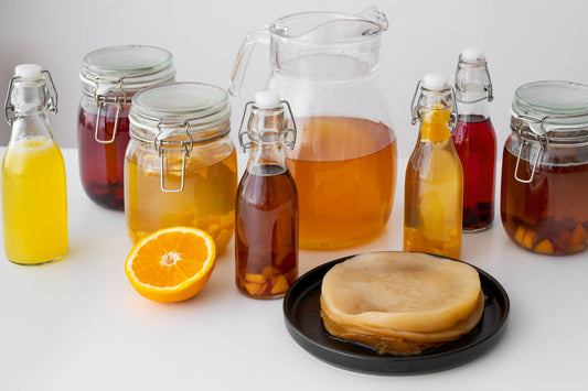 "Assorted fermented foods and drinks including kefir, kombucha, and miso"
